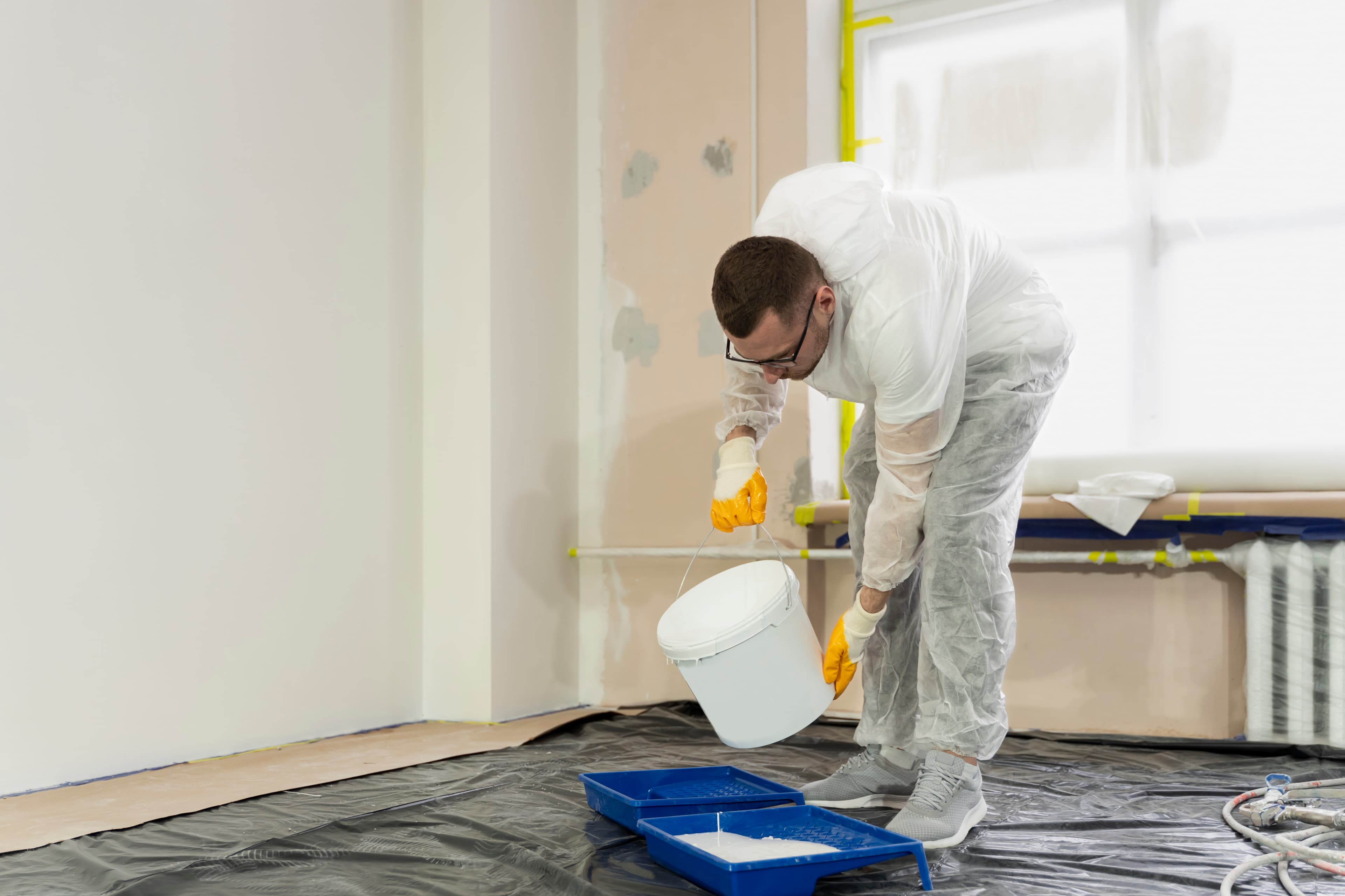 Man pouring paint